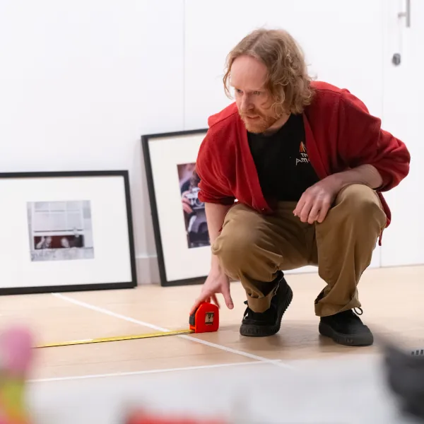 Photo of Ed setting up an exhibition