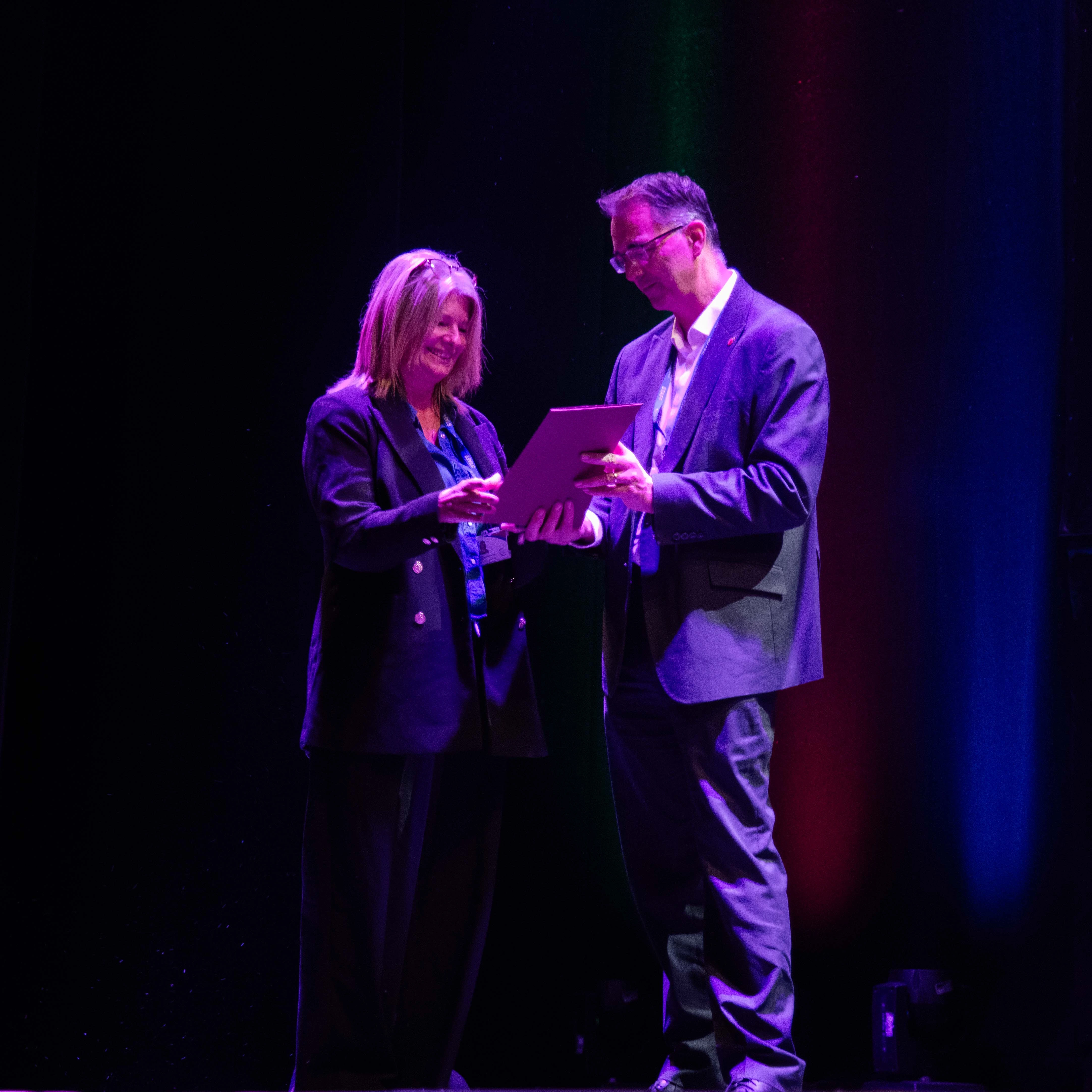 Photo of a member of staff being recognised at our annual awards ceremony