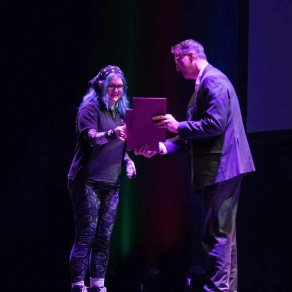 Photo of a member of staff being recognised at our annual awards ceremony